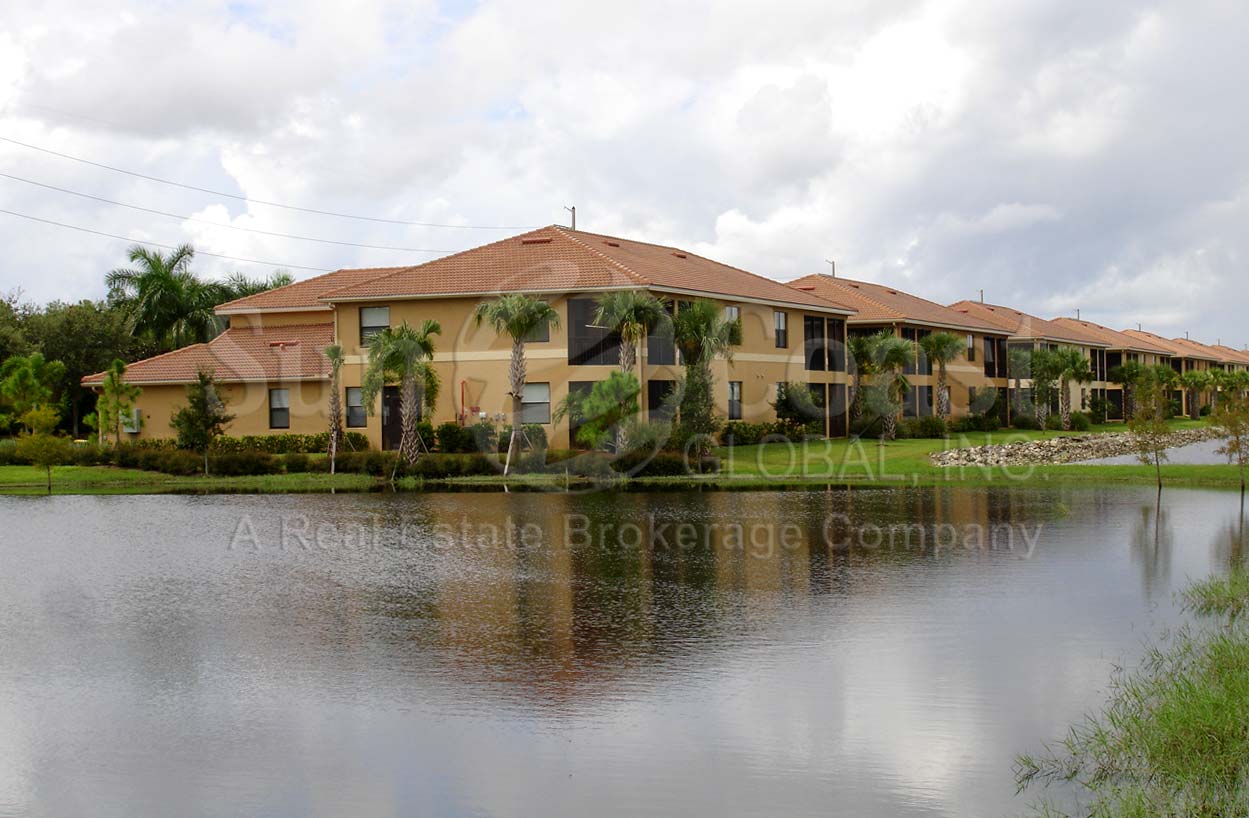 HERITAGE BAY waterfront coach homes with tile roofs, pavered drive and 2-car attached garages