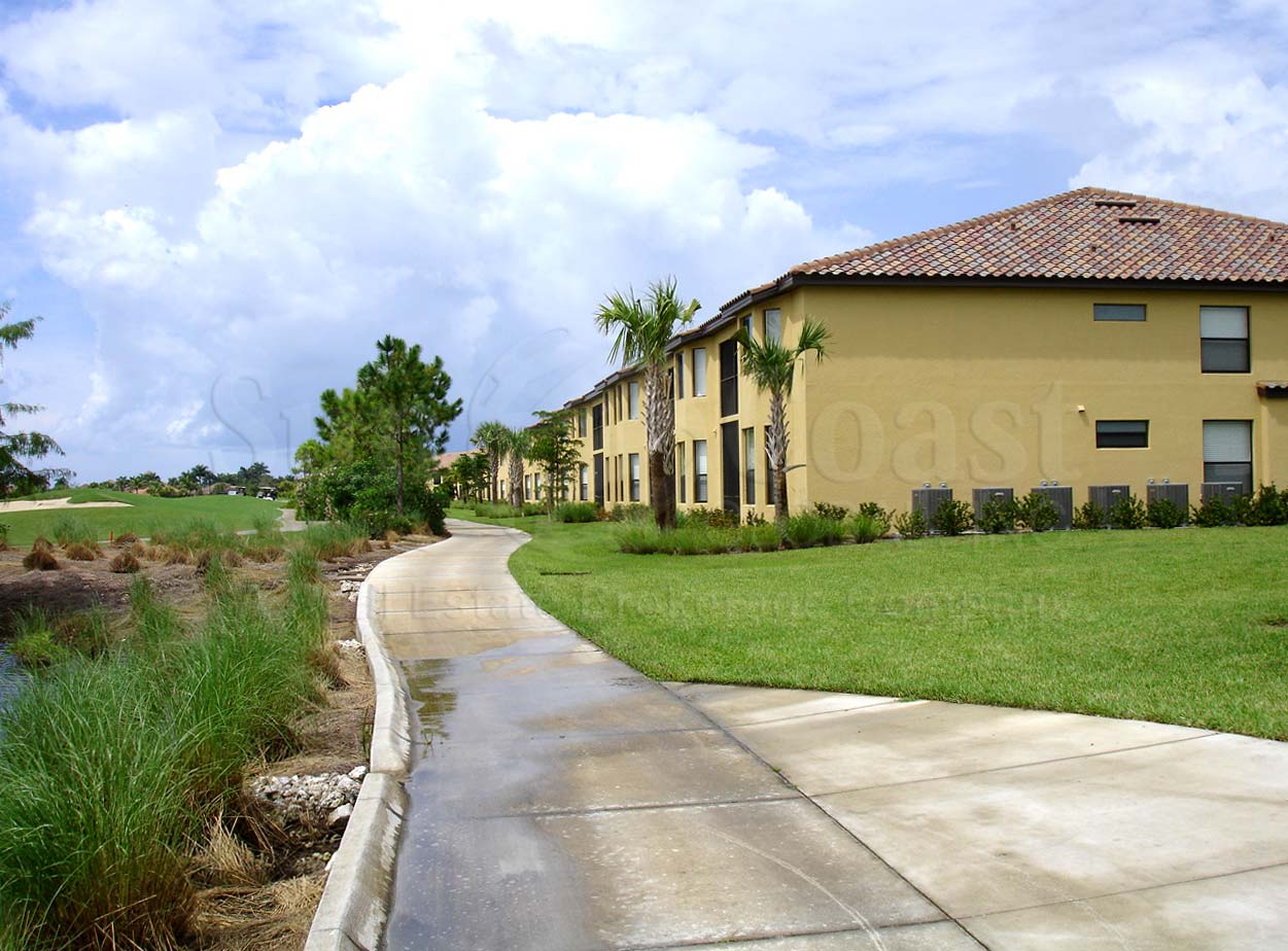 HERITAGE BAY Siesta Bay Drive 2-story condos with detached 1-car garages and tile roofs