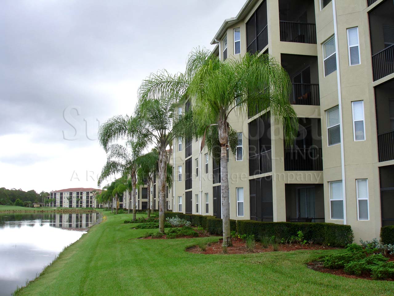 HERITAGE BAY Terraces are 4-story condos with tile roofs and car ports