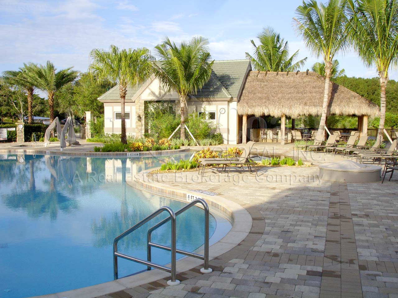 TWIN EAGLES Golf and Country Club pool area and tiki hut