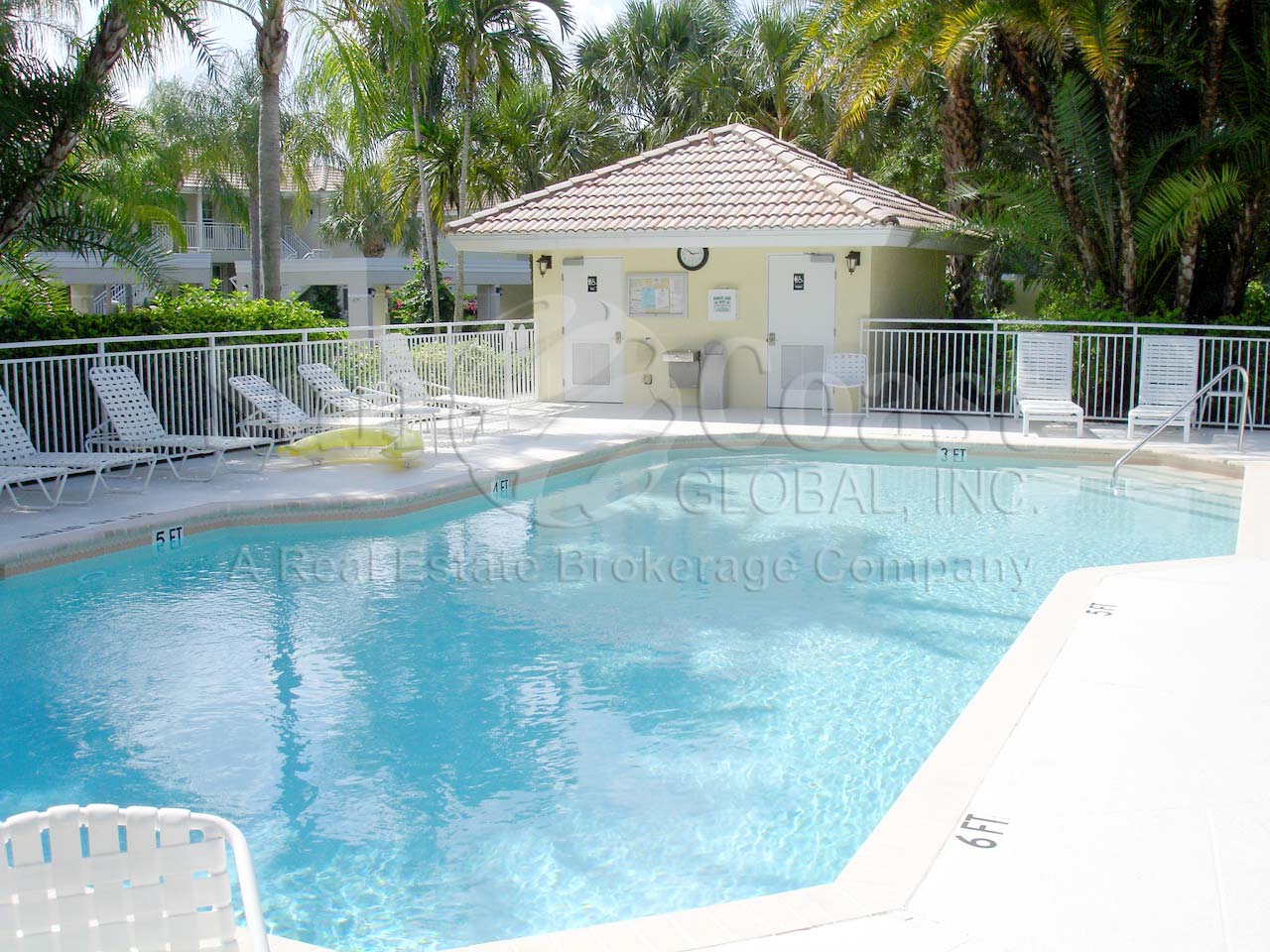 3-6 foot community pool with pavered deck and grill