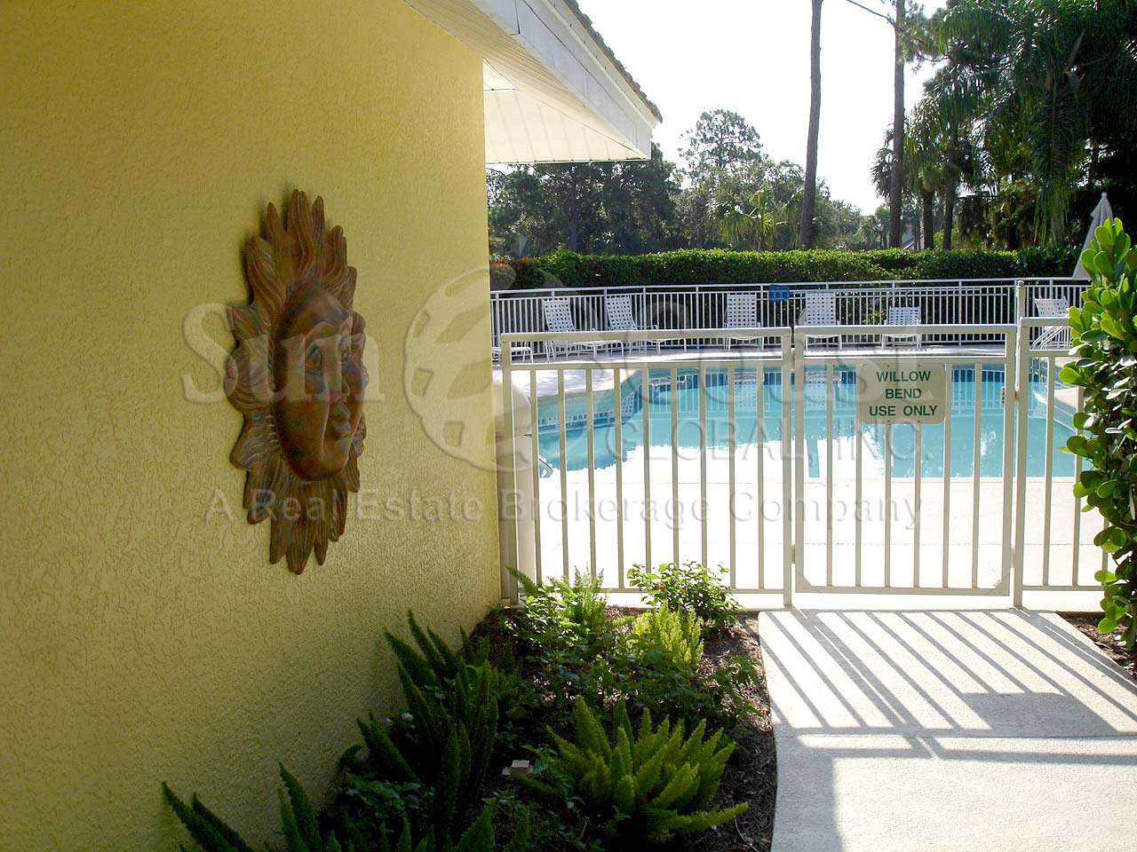Entrance to the 3-6 foot community pool with stamped pool area